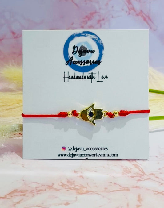 Blue sapphire hamsa red string